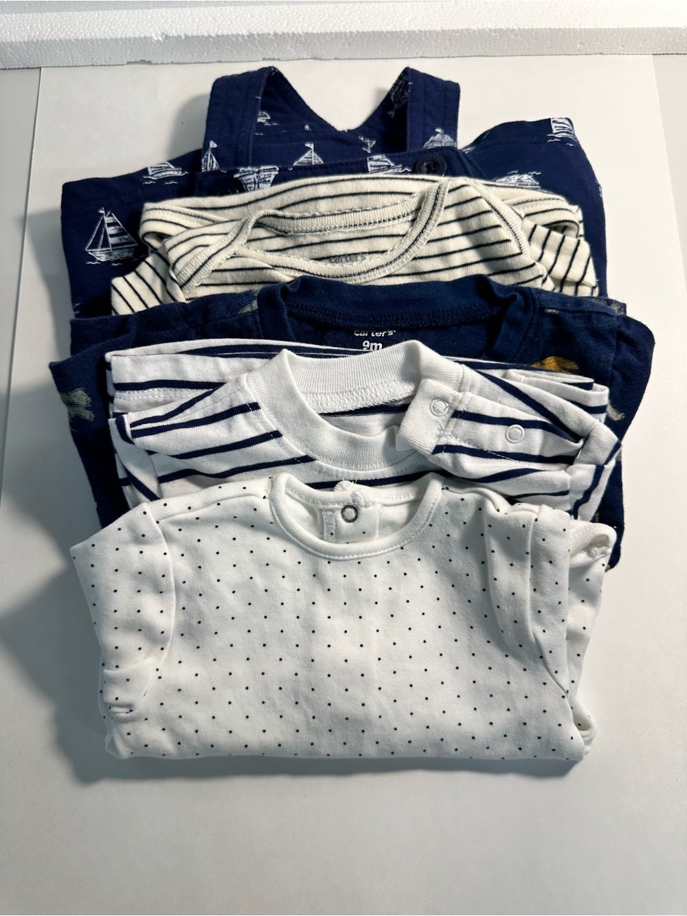 Lot of 5 baby items from Carter's and little Me colors white and Navy size 9M